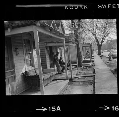 Two men on porch, Three children