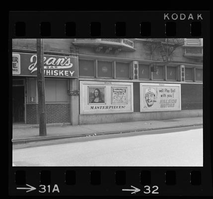 Picture showing Jean's Bar and advertisements for Pasqual's Pizza and Hillside Motors