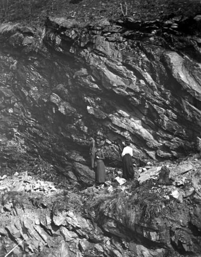 3 women standing on rock cliffs