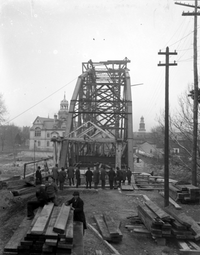 group of men looking up at a construction project in process