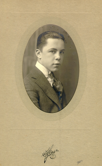 Teenage boy in a nice suit, framed on cardboard