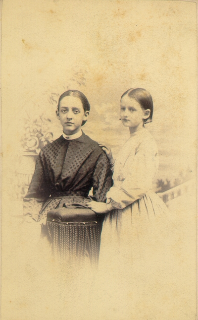 Lizzie and Helen Lyle standing by column