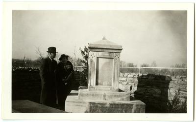 Man and woman by Governor Isaac Shelby's grave at Traveler's Rest