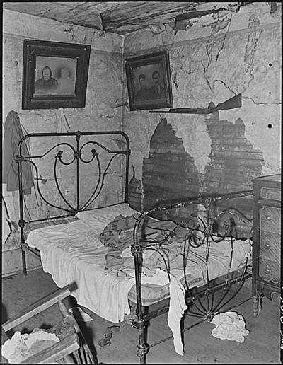 One of three rooms renting for $4 monthly in which eight people, four children and four adults, live.  This house is not owned by a coal mining company and is not rented through any company, but by an estate which rents this house to a miner.  Cary, Bell County, KY. 9/4/46