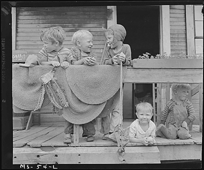 Children of miners on front porch of house in company project.  Osage, Monongalia County, W. Va. 6/14/46