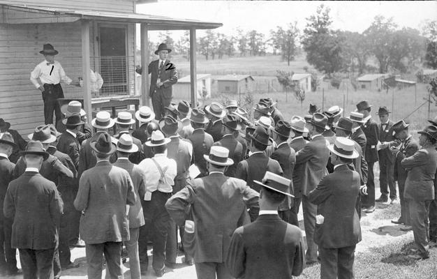 Group of men gathered at a meeting