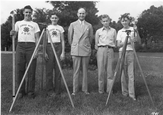 Five young men with surveying equipment during Junior Week at University of Kentucky, 1941