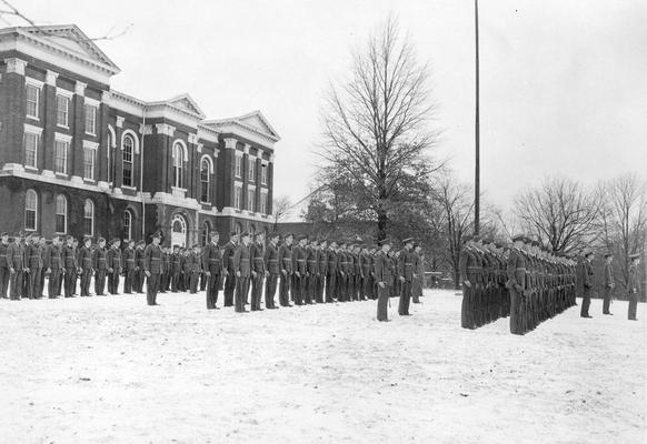 Administration Building, cadet formation in snow, circa 1940