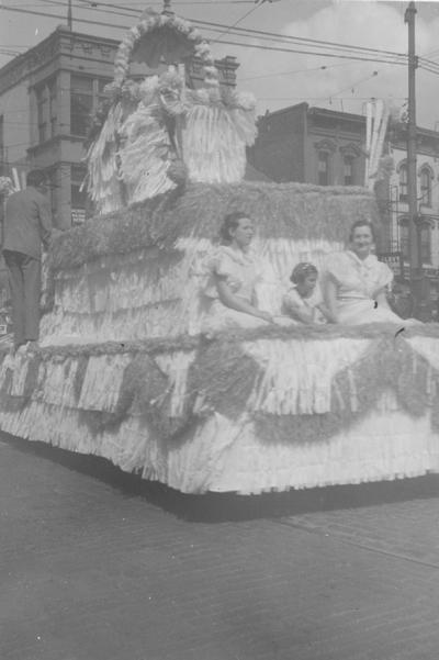 May Day Parade float passing the Levy Store in downtown Lexington, Kentucky