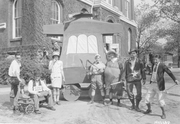 May Day, students pose in front of the float, 