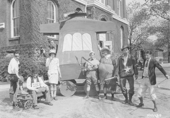 May Day, students pose in front of the float, 