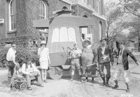 May Day, students pose in front of the float, 