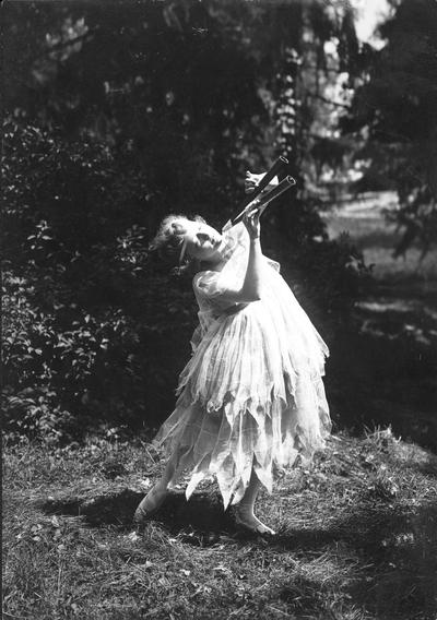 Woman in costume with a musical instrument