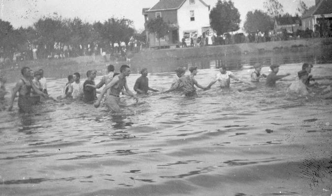 Student Tug-of-War at Clifton Pond, competition between freshman and sophomore classes, activity began in 1913 during Commencement festivities