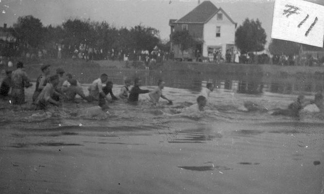 Student Tug-of-War at Clifton Pond, competition between freshman and sophomore classes, activity began in 1913 during Commencement festivities