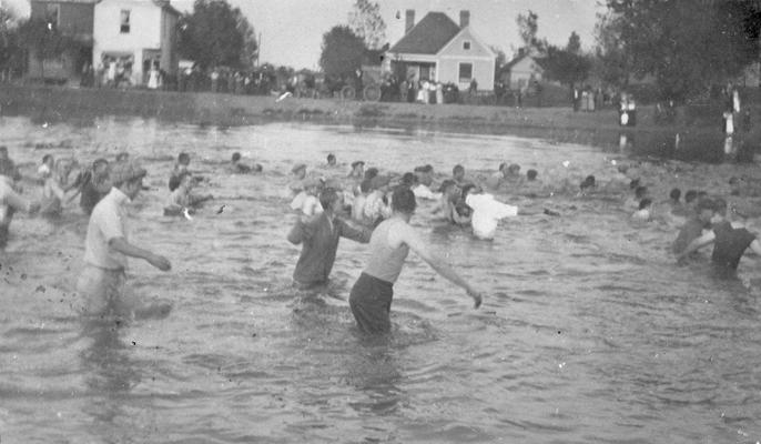 Student Tug-of-War at Clifton Pond, competition between freshman and sophomore classes, activity began in 1913 during Commencement festivities