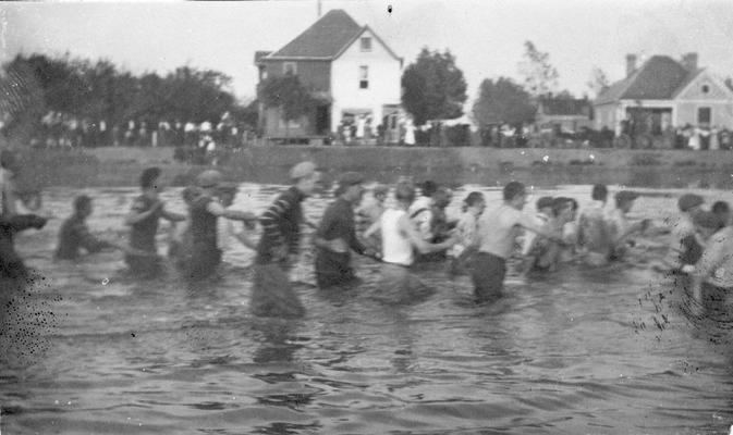 Student Tug-of-War at Clifton Pond, competition between freshman and sophomore classes, activity began in 1913 during Commencement festivities