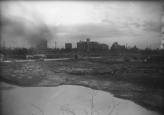 Barker Hall, Buell Armory, the Administration Building and other buildings in the distance, in foreground is dump