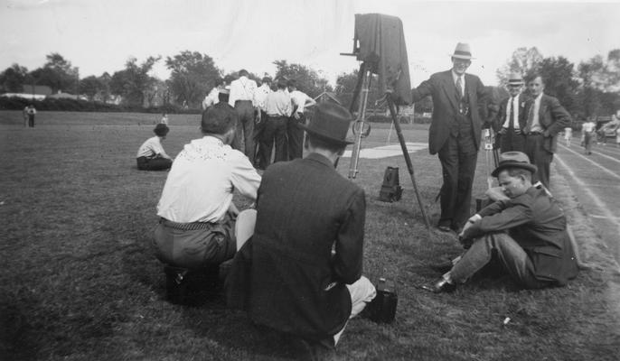 Paparazzi / Press and old tripod and camera