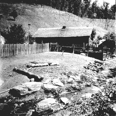 Log cabin in the mountains next to creek