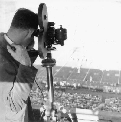 Ric Sanderson filming a football game at Stoll Field