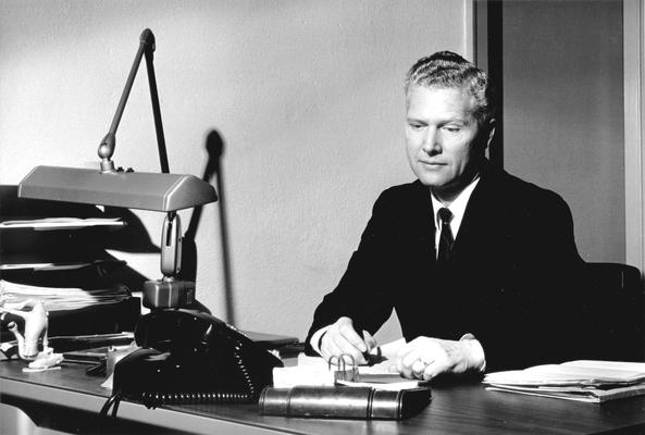 Stu Hallock sitting at desk