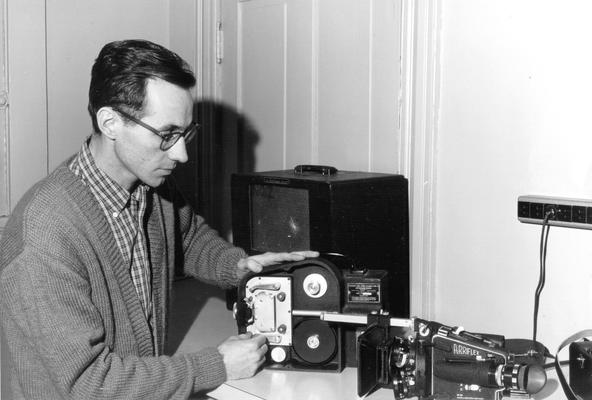 Man working with camera equipment