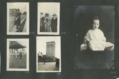 a woman standing on the road with houses in the background; 3 women; a man standing next to a gazebo; the road with cards on it, a large building in the background; postcard, a portrait of a baby sitting on a chair