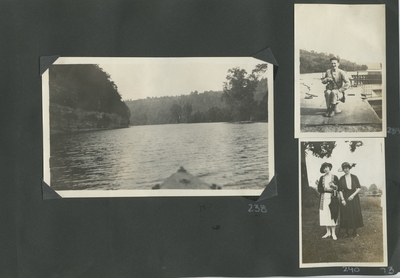 a view taken from a boat; a man sitting on a dock holding a camera; 2 women standing together outside