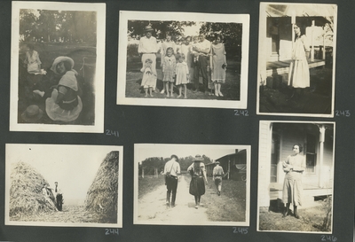 2 women sitting on the ground; a group portrait of men, women, and children; a woman standing next to the porch; 2 men standing next to a pile of hay; 2 men and a woman walking away along a path; a unidentified woman standing next to the porch