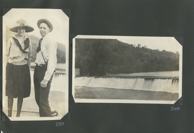 a man and woman standing; a small waterfall