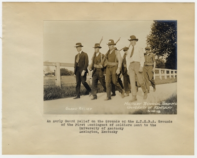 An early guard relief on the grounds of the K.T.H.B.A. grounds of the First Contingent of Soldiers sent to the University of Kentucky. Lexington, KY