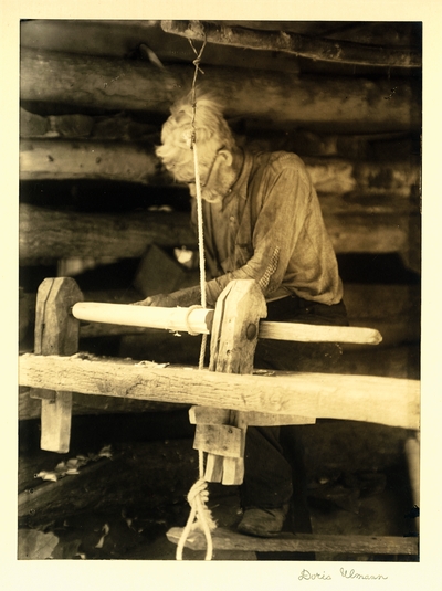 Henderson Mullins; Puncheon Creek Camp, Kentucky.  Elderly man in glasses, working at 