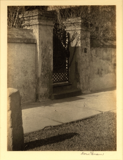 Monastery gate, South Carolina.  Stone wall and iron gate with sidewalk in front