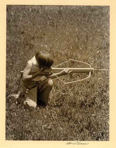 Pamela Luther Flynn Pitman Center.  Girl with crossbow