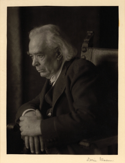 Richard Berry Harrison; Elderly man in suit and bow tie, seated in large chair, looking down