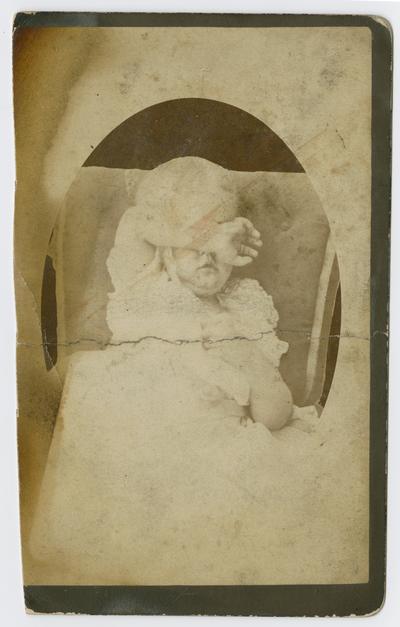 Linda Neville, aged about three years. She was at the photographer's and became non-cooperative