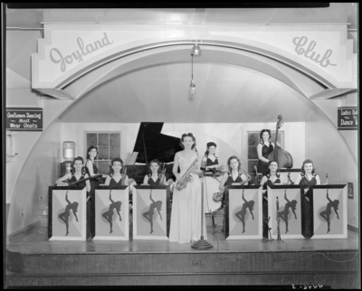 Herb Cook’s Orchestra; Betty Coed and the Debs; Joyland Club,                             interior, members performing on stage