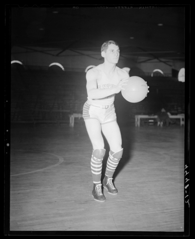 Varsity Basketball, (1940 Kentuckian) (University of Kentucky);                             interior, individual player on the court