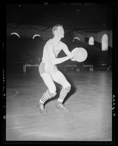 Varsity Basketball, (1940 Kentuckian) (University of Kentucky);                             interior, individual player on the court