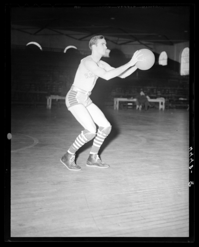 Varsity Basketball, (1940 Kentuckian) (University of Kentucky);                             interior, individual player on the court