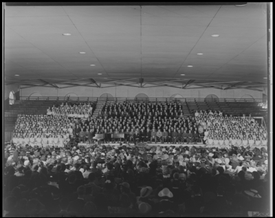 All State Chorus; Men's Gymnasium (Gym), University of                             Kentucky; interior, members sitting in bleachers, audience sitting in                             chairs on the court