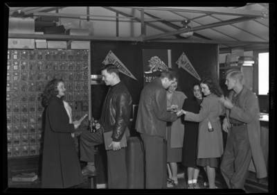 Georgetown College; interior; students gathered next to                             mailboxes