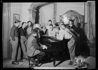 Georgetown College; Pi Kappa; men around piano