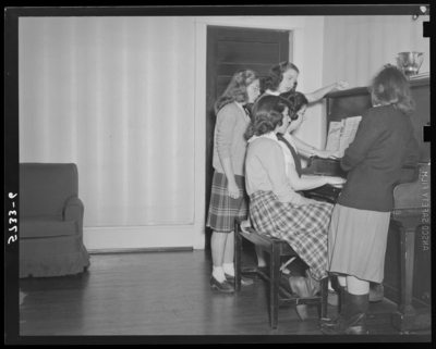 Georgetown College; girls standing in bedroom