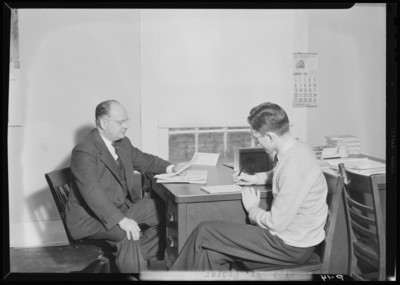 Georgetown College; Mr. Snyder sitting at desk