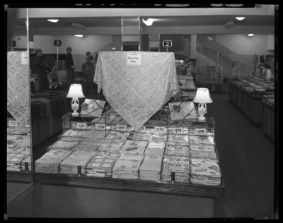 S.S. Kresge & Company (156, 250 West Main); plastic                             apron, tablecloth displays