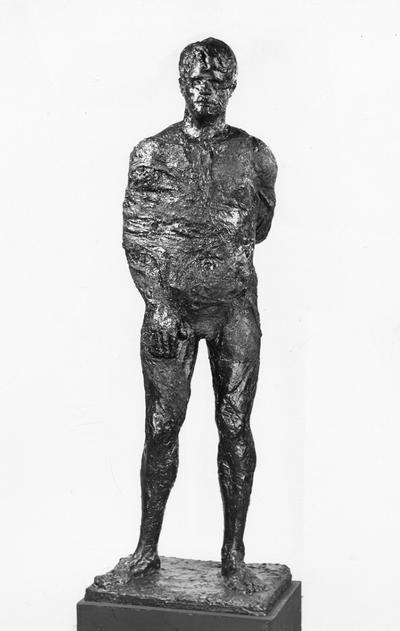 A fiberglass life size sculpture of a male nude standing by John Tuska