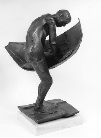 A bronze sculpture of a male nude entitled 