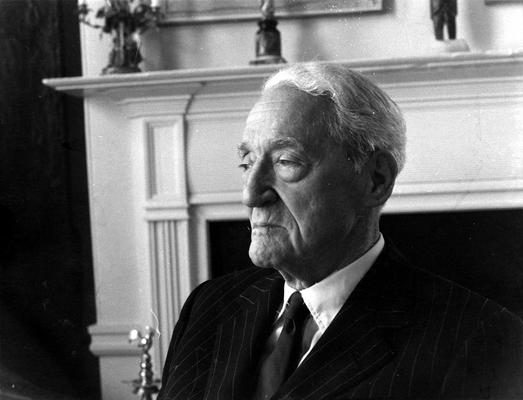 An image of John Sherman Cooper sitting for a clay bust study by John Tuska in Cooper's Washington D.C. apartment